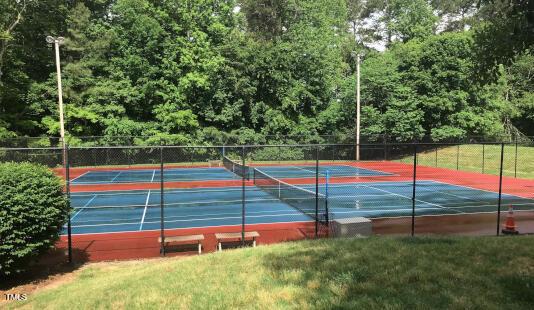 view of tennis court with fence