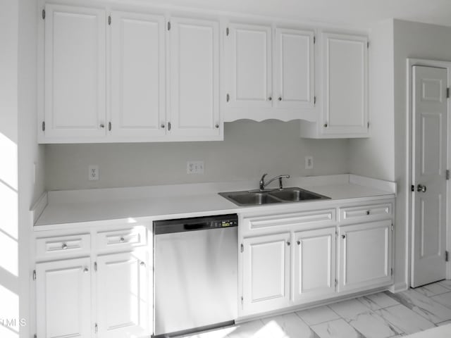 kitchen with marble finish floor, dishwasher, light countertops, and a sink