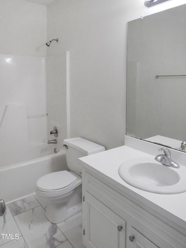 full bath featuring marble finish floor, tub / shower combination, vanity, and toilet