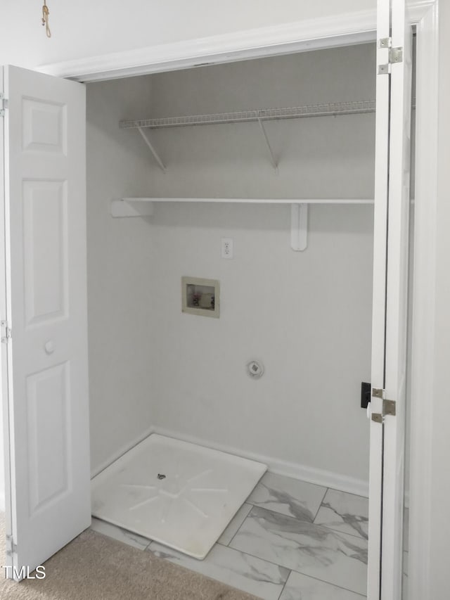 washroom with washer hookup, laundry area, baseboards, and marble finish floor