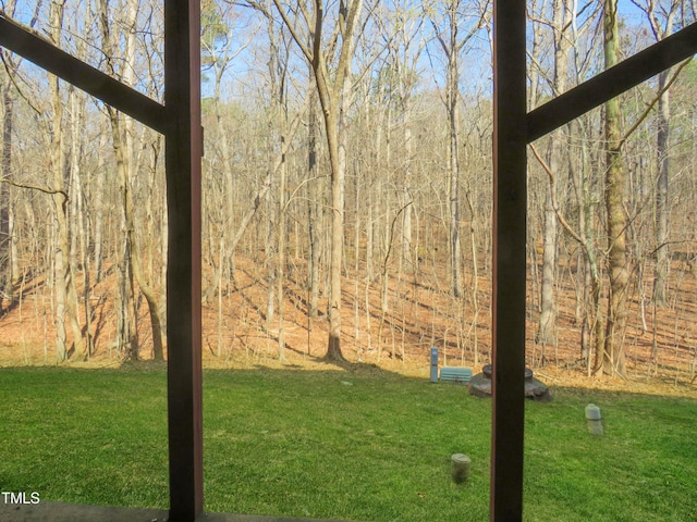 view of yard with a forest view