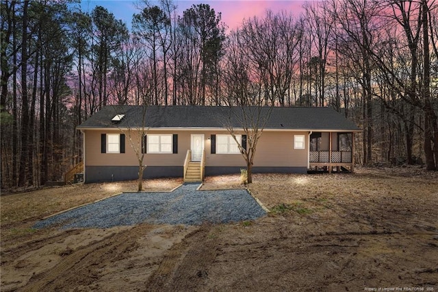 view of front of house with a sunroom