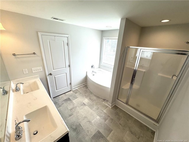 bathroom featuring visible vents, a stall shower, a sink, and a bath