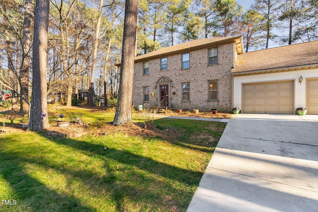 colonial home featuring a garage, concrete driveway, roof with shingles, a front lawn, and brick siding