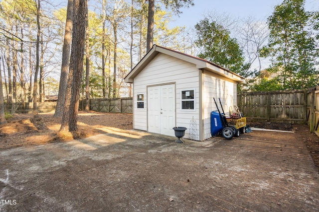 view of outbuilding with an outbuilding and a fenced backyard