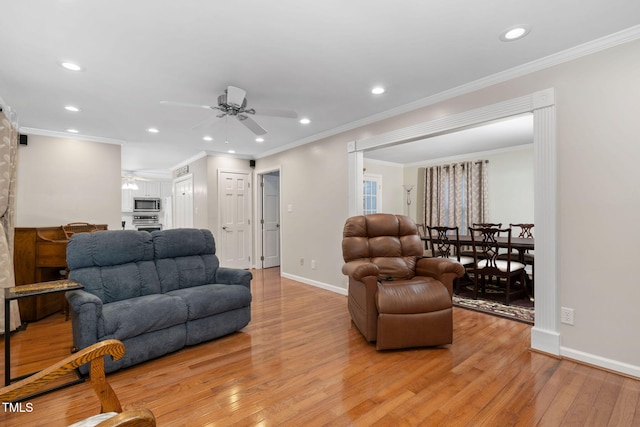 living area with recessed lighting, light wood-type flooring, and baseboards