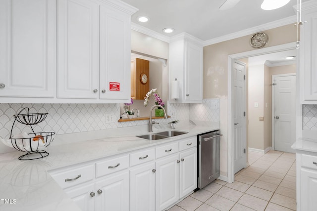 kitchen with crown molding, white cabinetry, dishwasher, and a sink