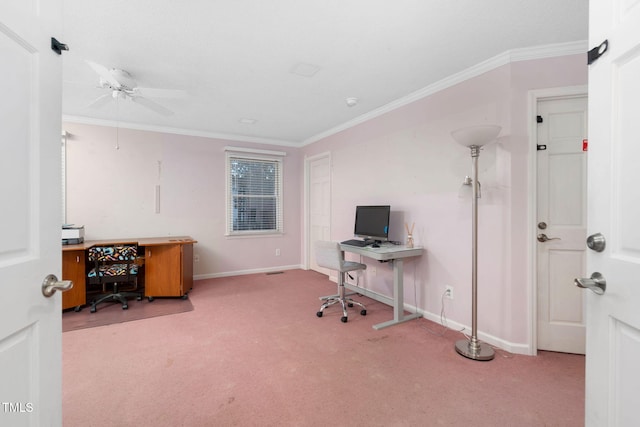 carpeted home office featuring baseboards, ceiling fan, and crown molding