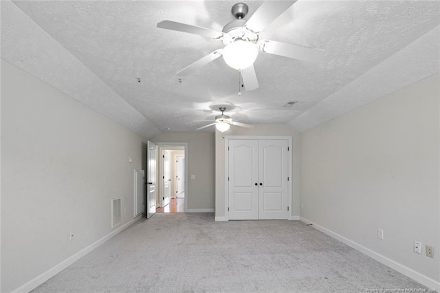 4305 Sanderosa Rd, Fayetteville, NC 28312 - unfurnished bedroom with a textured ceiling, light carpet, visible vents, baseboards, and a closet