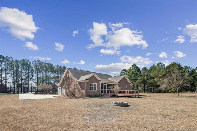 4305 Sanderosa Rd, Fayetteville, NC 28312 - view of front of home with concrete driveway, brick siding, crawl space, and a wooden deck