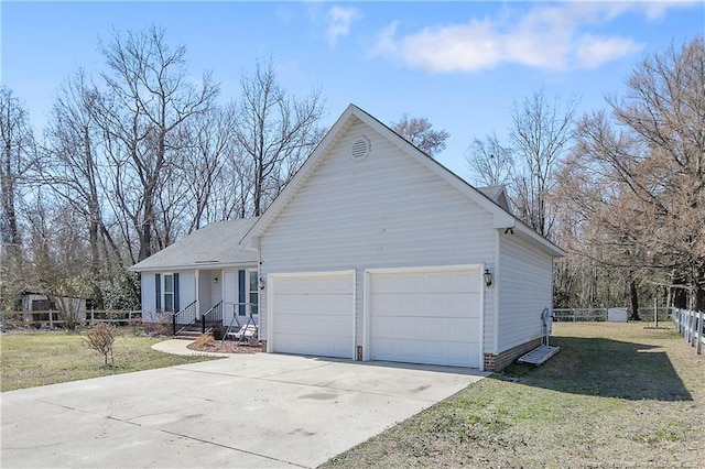 view of front of home with a garage, driveway, a front yard, and fence