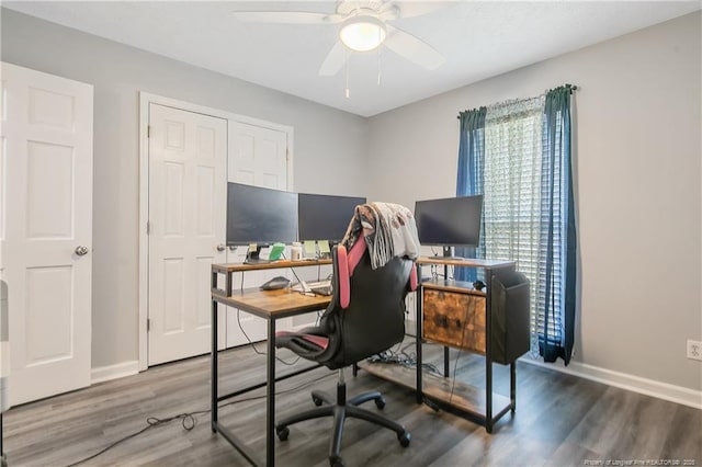 office featuring ceiling fan, wood finished floors, and baseboards