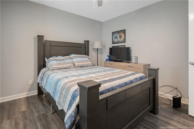 bedroom with a ceiling fan, baseboards, and wood finished floors