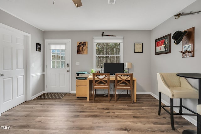 home office with visible vents, baseboards, and wood finished floors