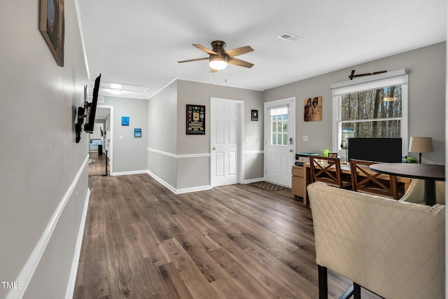 office with ceiling fan, dark wood finished floors, visible vents, and baseboards