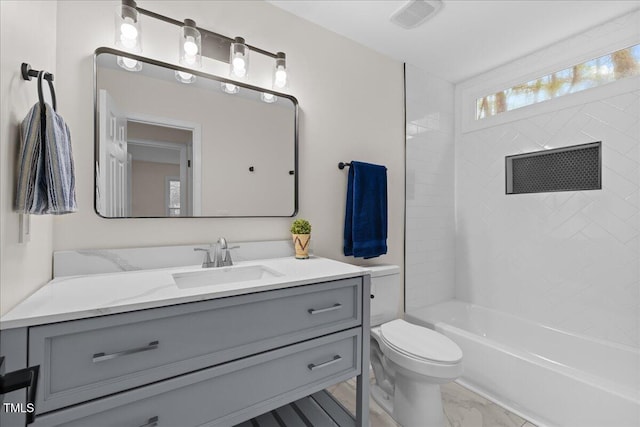 bathroom with toilet, visible vents, vanity, marble finish floor, and tub / shower combination