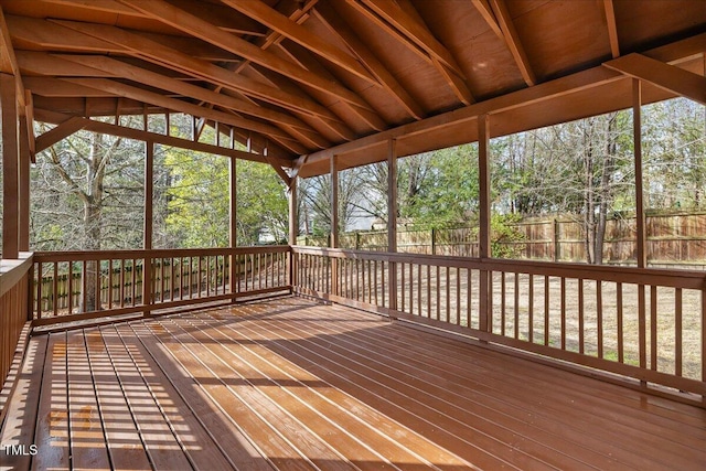 unfurnished sunroom with vaulted ceiling