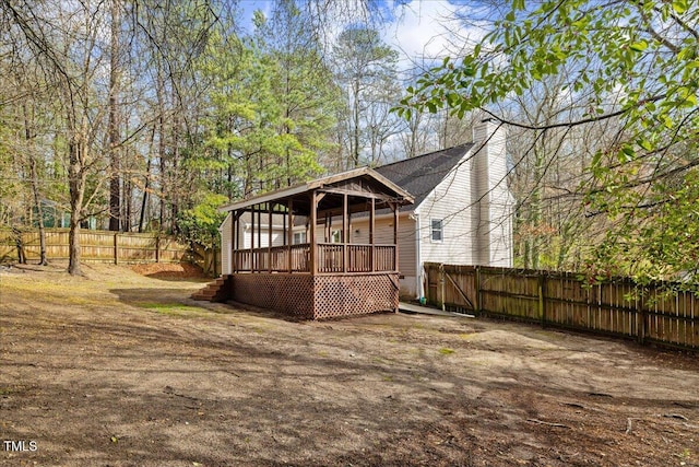 view of outdoor structure with a fenced backyard