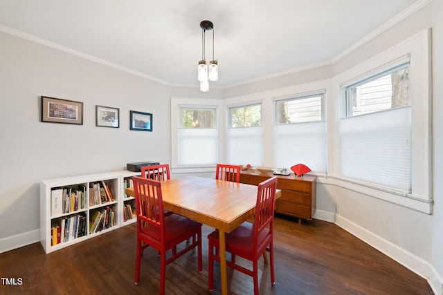 1209 Eva St, Durham, NC 27703 - dining area featuring baseboards, plenty of natural light, wood finished floors, and crown molding