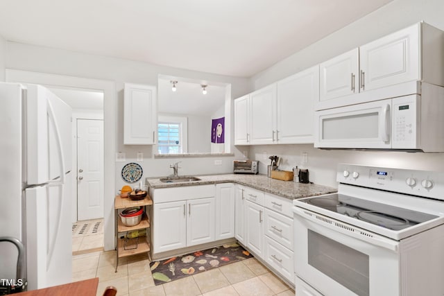 1209 Eva St, Durham, NC 27703 - kitchen featuring white appliances, a sink, white cabinets, and light tile patterned floors