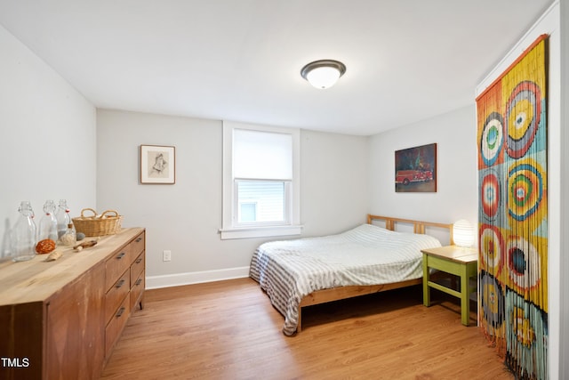 1209 Eva St, Durham, NC 27703 - bedroom with light wood-style floors and baseboards