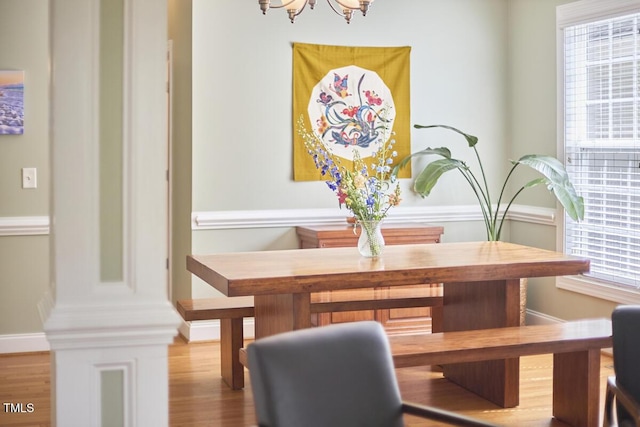 dining area featuring a chandelier and wood finished floors
