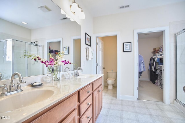 full bathroom with a shower stall, visible vents, and a sink
