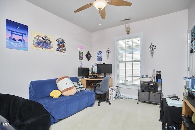 office space featuring a ceiling fan, baseboards, carpet, and visible vents