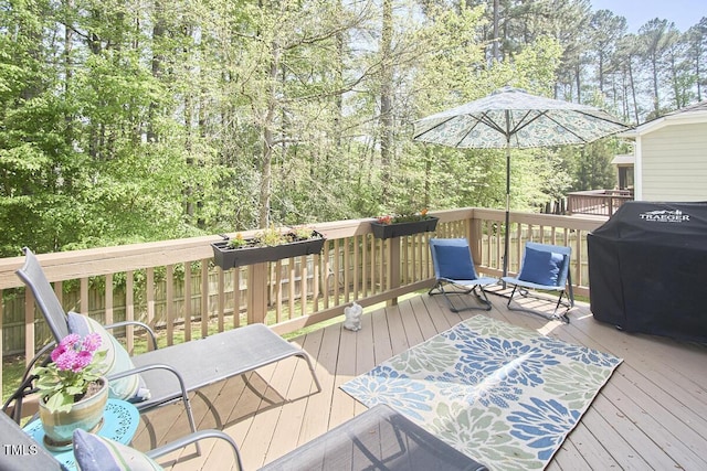 wooden terrace featuring grilling area
