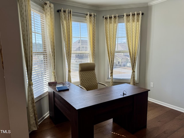 office area with dark wood-style floors, crown molding, baseboards, and a wealth of natural light