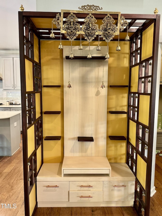 mudroom with wood finished floors