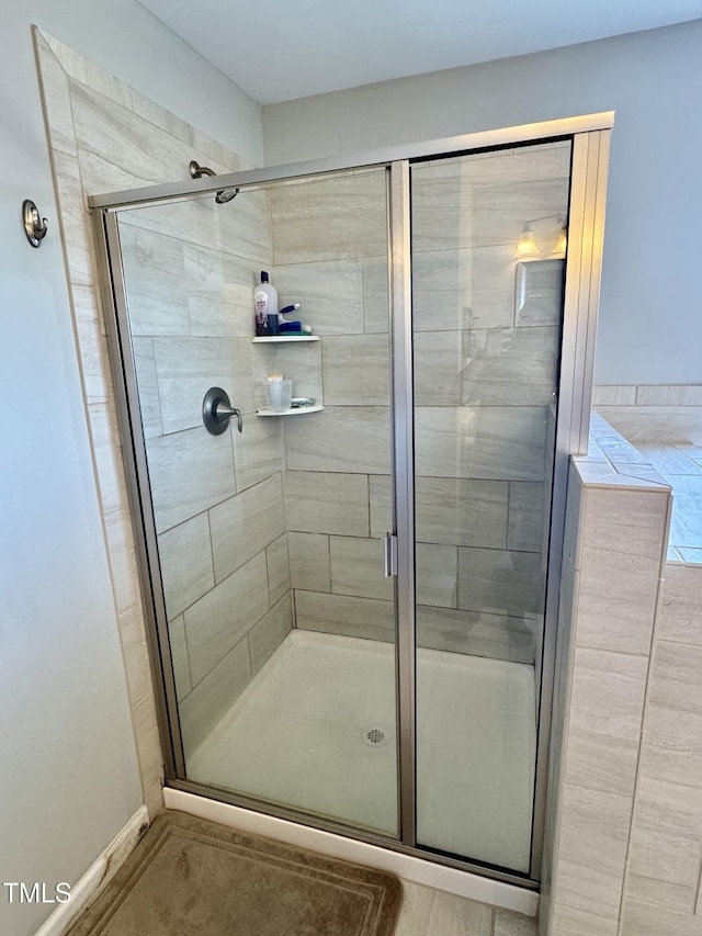 bathroom with a stall shower