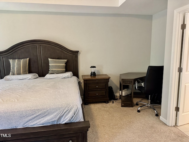 bedroom featuring carpet floors and baseboards