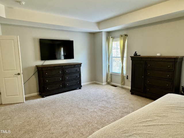 bedroom featuring carpet, visible vents, and baseboards