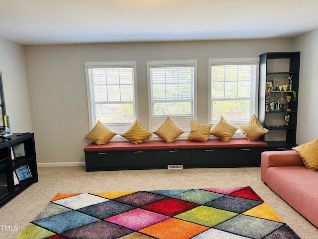 rec room featuring carpet flooring, visible vents, and baseboards