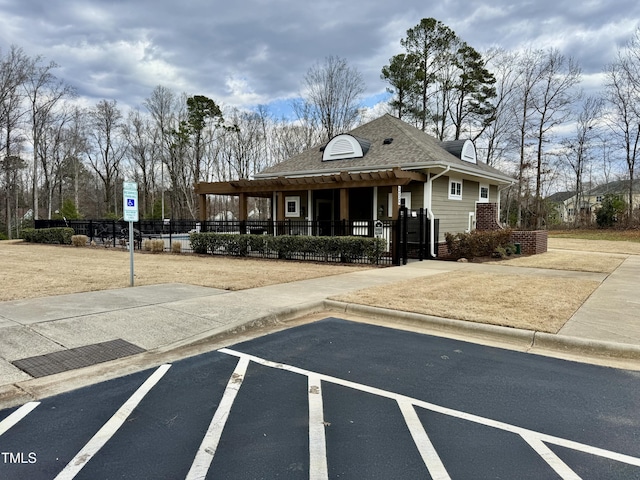 view of building exterior featuring a fenced front yard