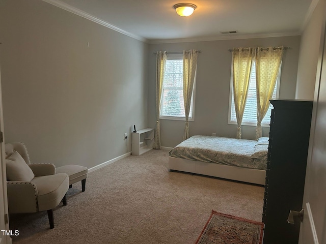 carpeted bedroom featuring visible vents, baseboards, and crown molding