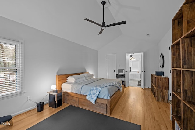 bedroom with ceiling fan, baseboards, light wood-style flooring, and vaulted ceiling