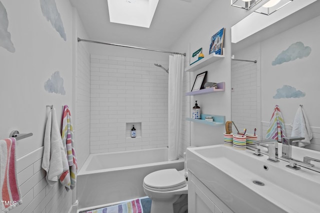 full bath featuring shower / bathtub combination with curtain, toilet, a skylight, and vanity