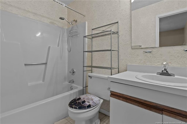 full bathroom with toilet, wallpapered walls, washtub / shower combination, and vanity