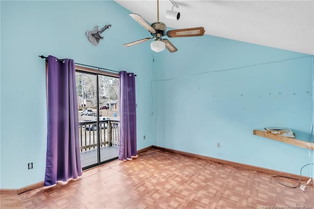 empty room featuring ceiling fan, high vaulted ceiling, and baseboards