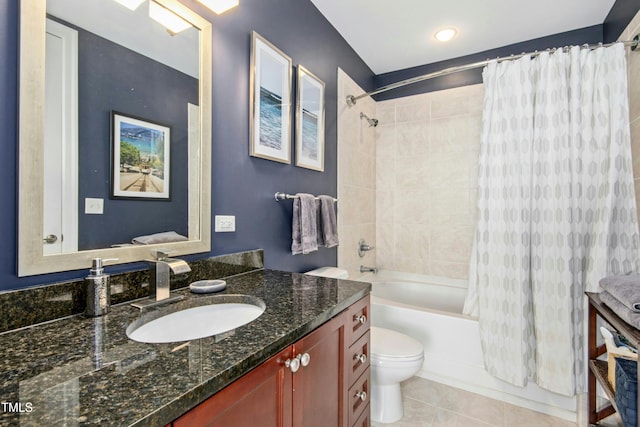 bathroom featuring shower / tub combo, tile patterned flooring, vanity, and toilet