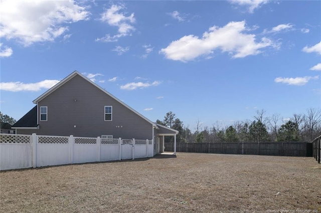 exterior space featuring a fenced backyard