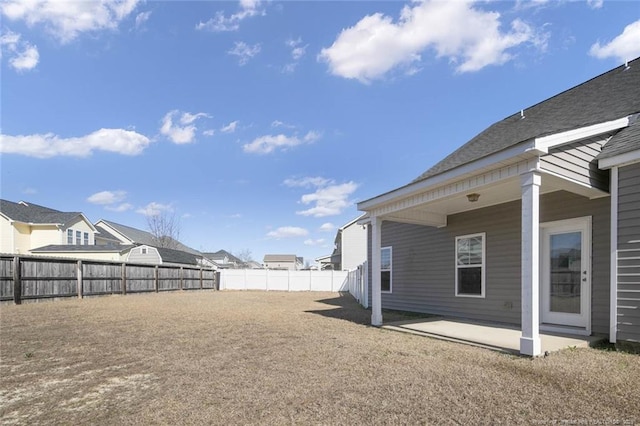 view of yard with a patio area and a fenced backyard