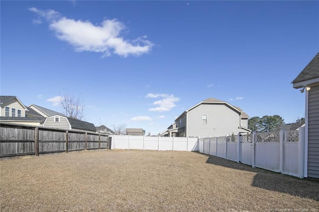 view of yard with a fenced backyard