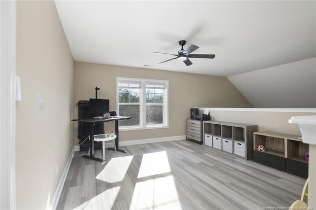 office area featuring lofted ceiling, wood finished floors, a ceiling fan, and baseboards