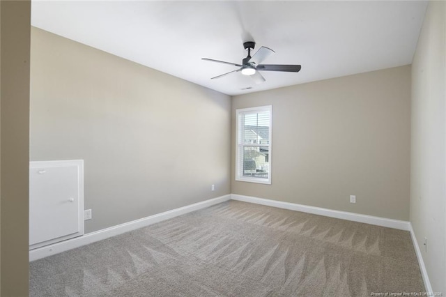 unfurnished room with carpet, baseboards, and ceiling fan