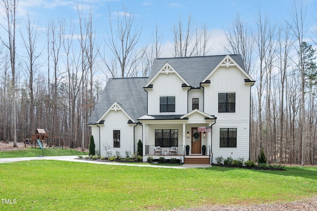 1124 Westridge Rd, Rougemont, NC 27572 - modern farmhouse featuring board and batten siding, a porch, a front lawn, and a shingled roof