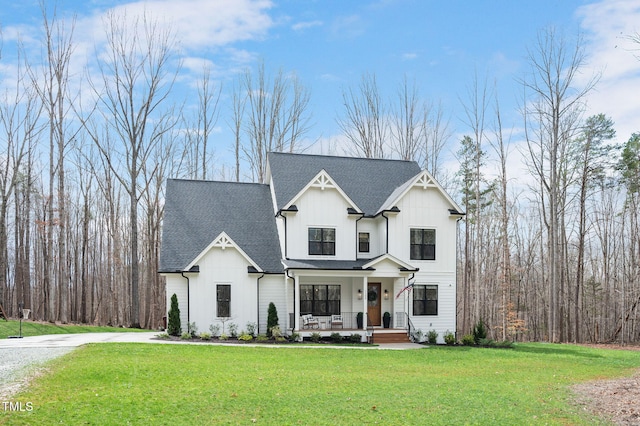 1124 Westridge Rd, Rougemont, NC 27572 - modern inspired farmhouse with a porch, board and batten siding, roof with shingles, and a front lawn