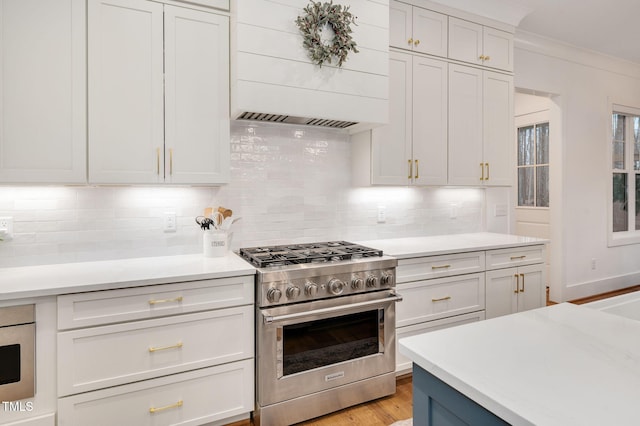 1124 Westridge Rd, Rougemont, NC 27572 - kitchen featuring backsplash, high end stove, and light countertops